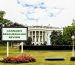 Billboard announcing 'CANNABIS RESCHEDULING REVIEW' on the lawn in front of the White House.