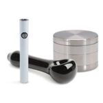 High-quality cannabis accessories including a sleek vaporizer pen and a durable grinder from Sacramento's premium weed delivery service.